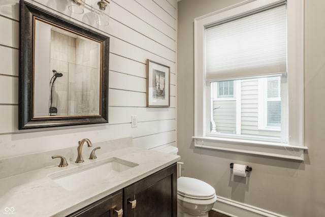 5254 N Park Ave, Indianapolis, IN 46220 - bathroom with toilet, vanity, and wood walls