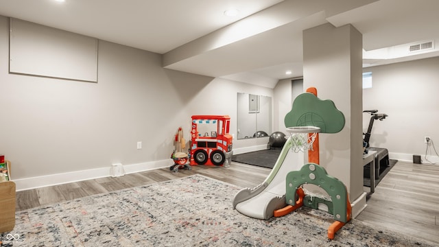 5254 N Park Ave, Indianapolis, IN 46220 - recreation room featuring wood finished floors, baseboards, and recessed lighting