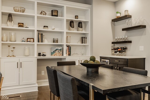 5254 N Park Ave, Indianapolis, IN 46220 - dining space featuring dark wood-style floors, a bar, and built in features