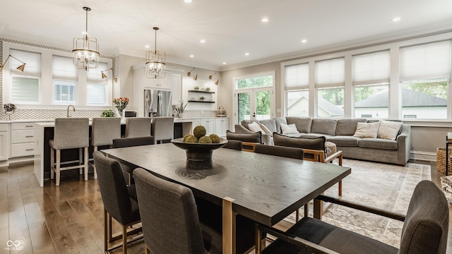 5254 N Park Ave, Indianapolis, IN 46220 - dining space with ornamental molding, dark wood-type flooring, recessed lighting, and a chandelier