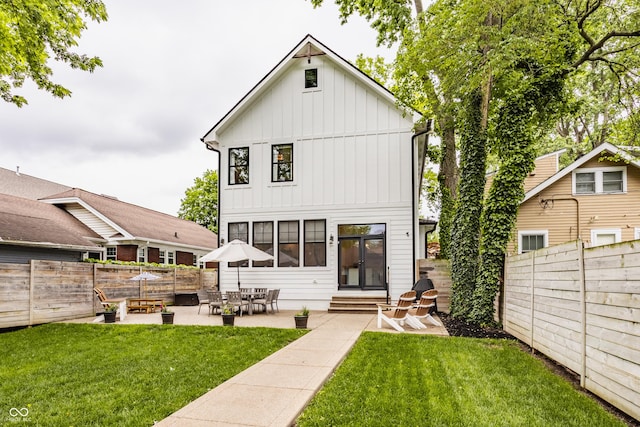 5254 N Park Ave, Indianapolis, IN 46220 - rear view of property featuring entry steps, board and batten siding, and a patio