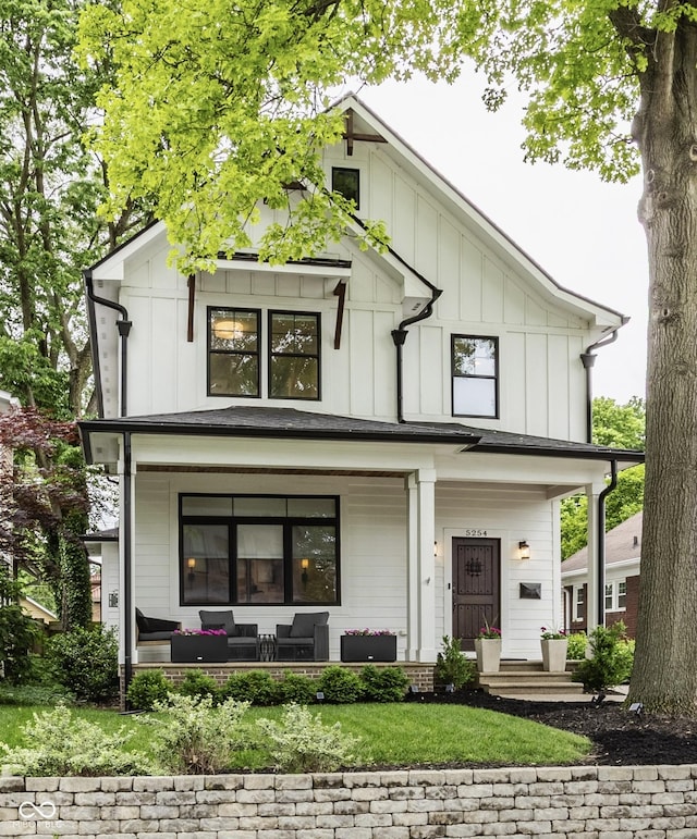 5254 N Park Ave, Indianapolis, IN 46220 - view of front of home with a porch, an outdoor living space, and board and batten siding