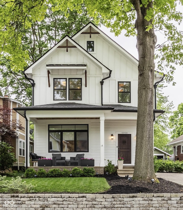 5254 N Park Ave, Indianapolis, IN 46220 - modern inspired farmhouse with a porch, board and batten siding, and outdoor lounge area