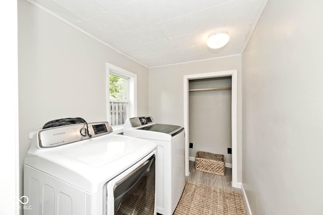 4910 W Caven St, Indianapolis, IN 46241 - laundry room with washer and clothes dryer, crown molding, and baseboards