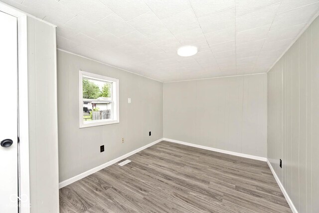 4910 W Caven St, Indianapolis, IN 46241 - empty room with wood finished floors and baseboards
