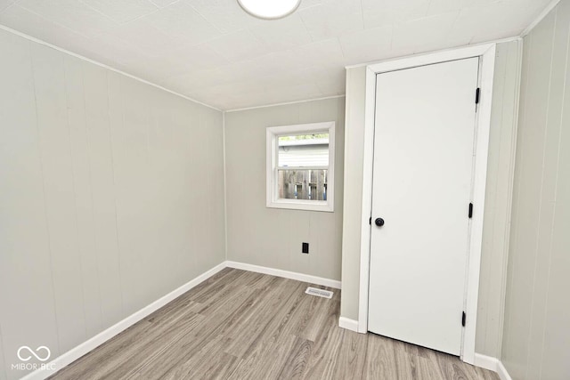 4910 W Caven St, Indianapolis, IN 46241 - unfurnished bedroom with light wood-style flooring and baseboards
