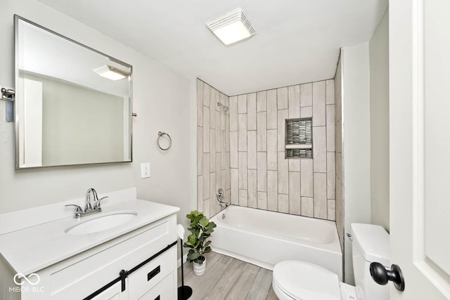 4910 W Caven St, Indianapolis, IN 46241 - full bath featuring toilet, wood finished floors, vanity, and shower / bath combination