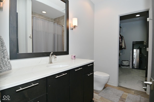 7070 Dean Rd, Indianapolis, IN 46220 - bathroom featuring wood finished floors, vanity, and toilet