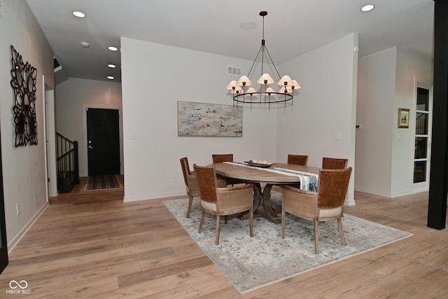 7070 Dean Rd, Indianapolis, IN 46220 - dining room with recessed lighting, light wood-style flooring, a chandelier, baseboards, and stairway