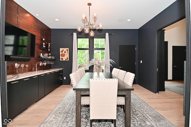 7070 Dean Rd, Indianapolis, IN 46220 - dining area featuring wet bar, light wood-style floors, a chandelier, and recessed lighting