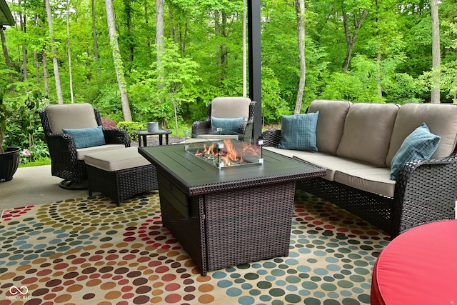 7070 Dean Rd, Indianapolis, IN 46220 - view of patio featuring a forest view and an outdoor living space with a fire pit