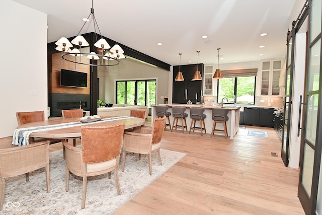 7070 Dean Rd, Indianapolis, IN 46220 - dining space with a chandelier, light wood finished floors, and recessed lighting