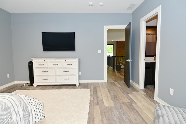 7070 Dean Rd, Indianapolis, IN 46220 - bedroom featuring light wood-style floors and baseboards