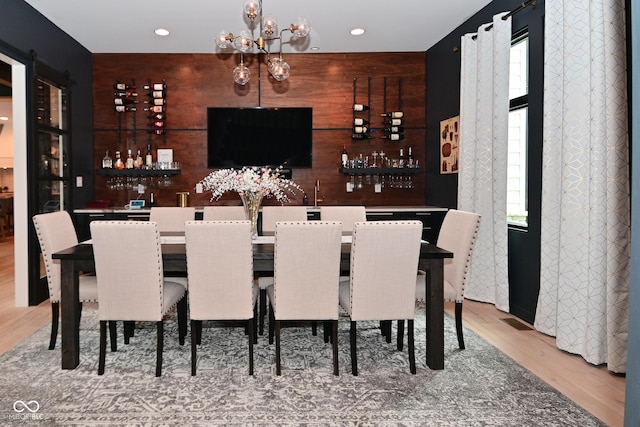 7070 Dean Rd, Indianapolis, IN 46220 - indoor wet bar with light wood-style flooring, recessed lighting, and a chandelier