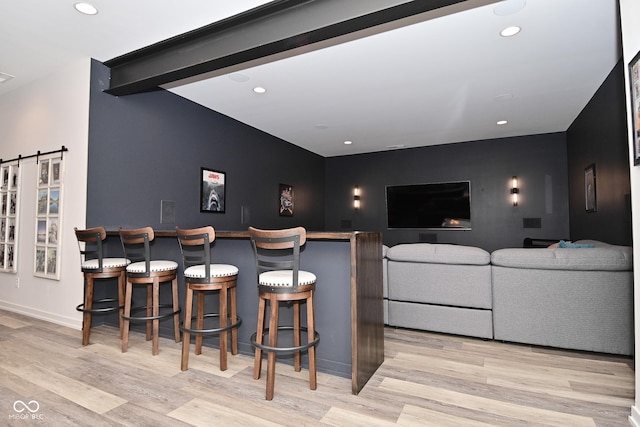 7070 Dean Rd, Indianapolis, IN 46220 - cinema room featuring recessed lighting, wood finished floors, baseboards, and a barn door