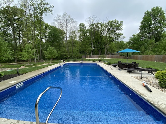 7070 Dean Rd, Indianapolis, IN 46220 - view of swimming pool featuring a patio, a diving board, and view of scattered trees