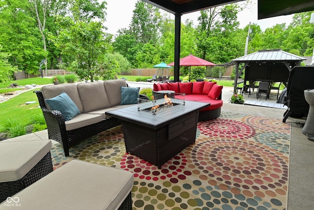 7070 Dean Rd, Indianapolis, IN 46220 - fenced backyard featuring an outdoor living space with a fire pit, a patio, outdoor dining space, a gazebo, and view of scattered trees