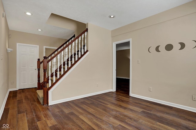 7637 Sand Run Ct, Indianapolis, IN 46259 - foyer entrance with wood finished floors, baseboards, stairway, and recessed lighting