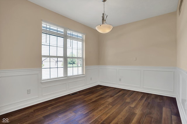 7637 Sand Run Ct, Indianapolis, IN 46259 - empty room featuring healthy amount of natural light, wainscoting, and dark wood finished floors