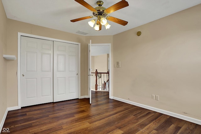 7637 Sand Run Ct, Indianapolis, IN 46259 - unfurnished bedroom featuring baseboards, dark wood-style floors, a closet, and ceiling fan