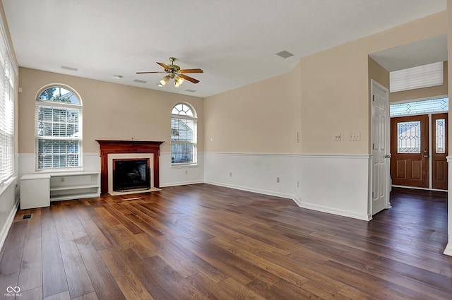 7637 Sand Run Ct, Indianapolis, IN 46259 - unfurnished living room with dark wood-type flooring, ceiling fan, a fireplace with flush hearth, and baseboards