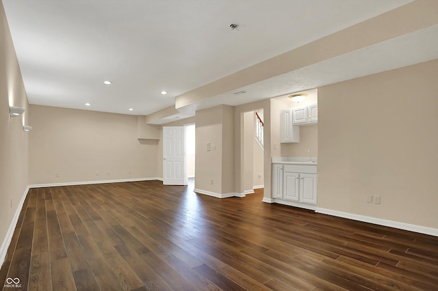 7637 Sand Run Ct, Indianapolis, IN 46259 - finished basement with dark wood-style floors, baseboards, a sink, and recessed lighting