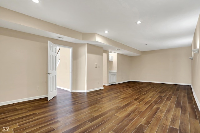 7637 Sand Run Ct, Indianapolis, IN 46259 - below grade area featuring dark wood-style flooring, recessed lighting, and baseboards