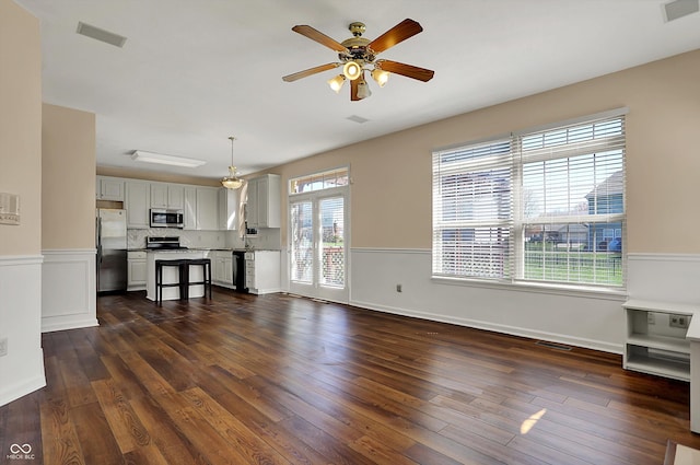 7637 Sand Run Ct, Indianapolis, IN 46259 - unfurnished living room featuring ceiling fan, dark wood-type flooring, a sink, and baseboards