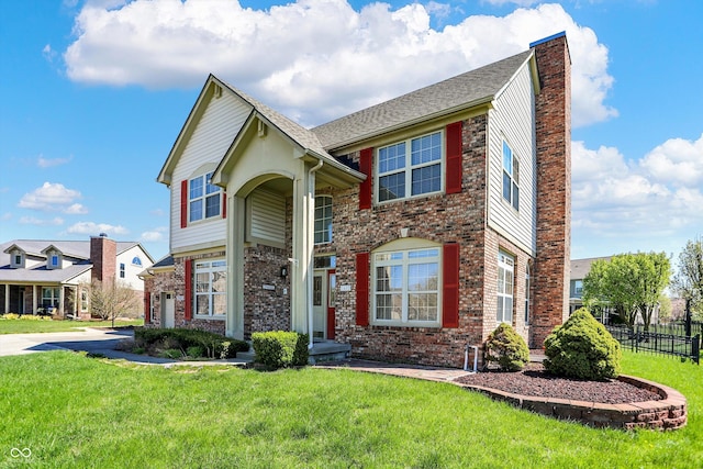 7637 Sand Run Ct, Indianapolis, IN 46259 - traditional-style home featuring driveway, a chimney, brick siding, and an attached garage