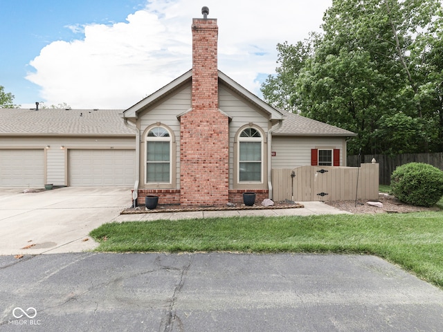 811 Gazebo Way, Greenwood, IN 46142 - ranch-style home featuring driveway, a garage, a chimney, brick siding, and roof with shingles