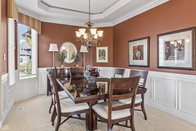16502 Grand Cypress Dr, Noblesville, IN 46060 - dining room featuring light carpet, a chandelier, a decorative wall, ornamental molding, and a raised ceiling