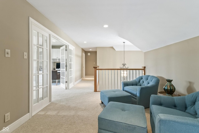 16502 Grand Cypress Dr, Noblesville, IN 46060 - living room with french doors, light colored carpet, baseboards, recessed lighting, and a chandelier