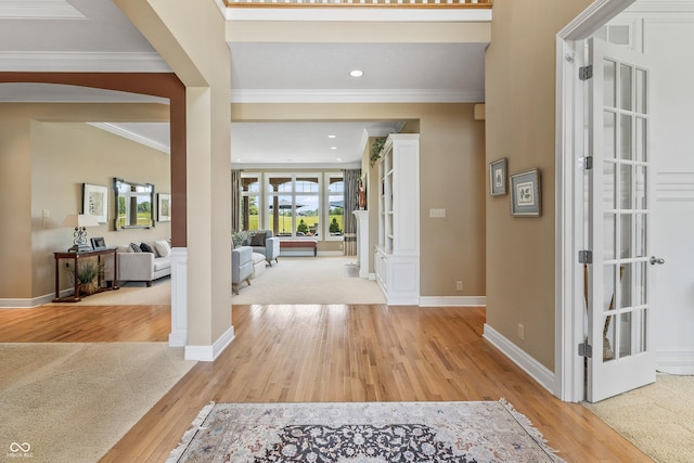 16502 Grand Cypress Dr, Noblesville, IN 46060 - entrance foyer featuring arched walkways, light wood-style floors, ornamental molding, baseboards, and recessed lighting