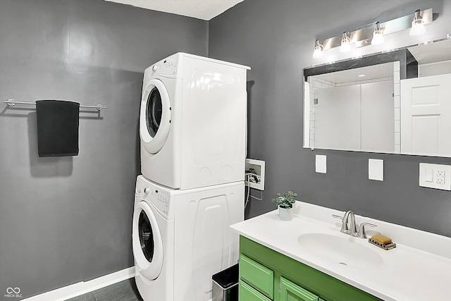 514 Dorman St, Indianapolis, IN 46202 - washroom featuring stacked washing machine and dryer and baseboards