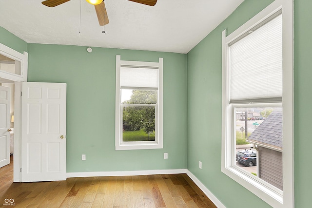 514 Dorman St, Indianapolis, IN 46202 - spare room featuring hardwood / wood-style floors, a ceiling fan, and baseboards