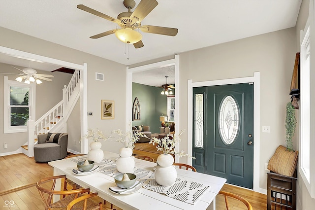 514 Dorman St, Indianapolis, IN 46202 - foyer featuring light wood-style flooring, ceiling fan, stairs, and baseboards