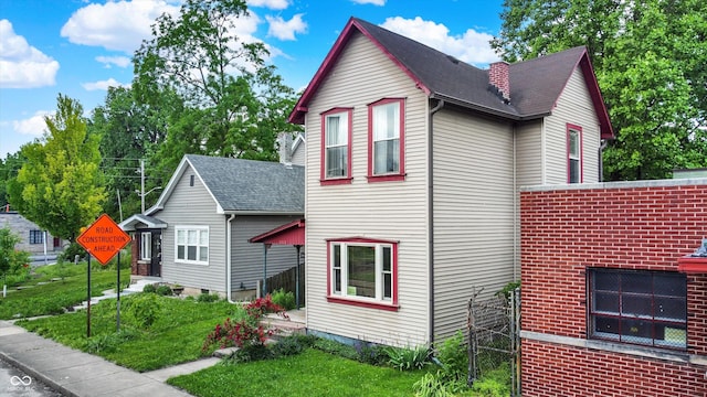 514 Dorman St, Indianapolis, IN 46202 - view of side of home with roof with shingles