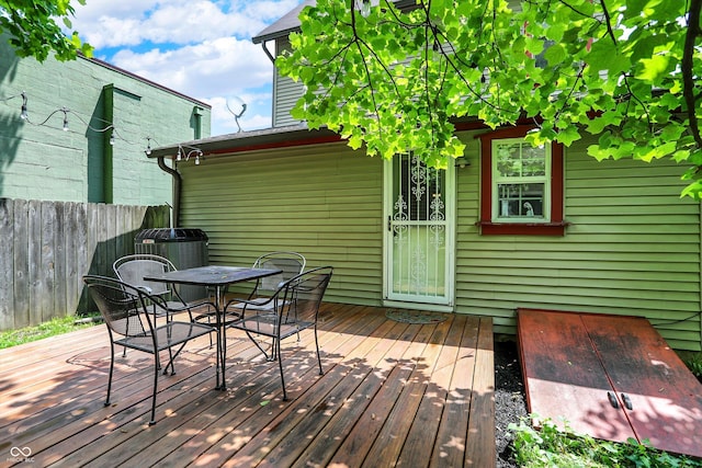 514 Dorman St, Indianapolis, IN 46202 - wooden terrace featuring outdoor dining area and cooling unit