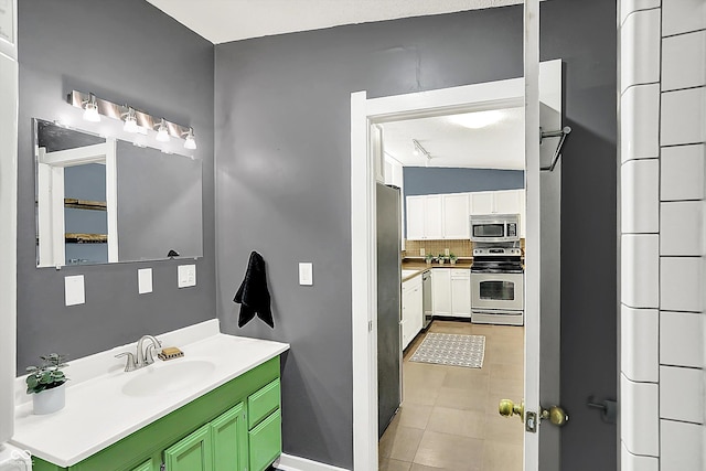514 Dorman St, Indianapolis, IN 46202 - bathroom with vanity and decorative backsplash