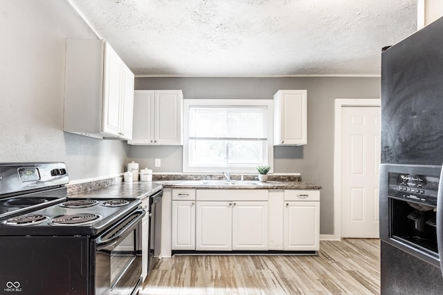 4409 N College Ave, Indianapolis, IN 46205 - kitchen featuring black electric range, light wood-type flooring, white cabinets, and a textured ceiling