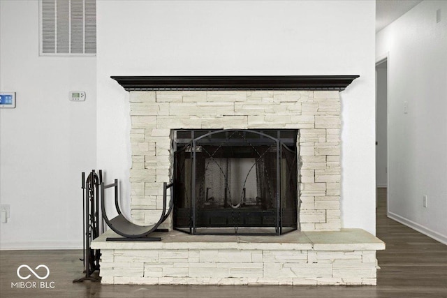 11821 Wapiti Way, Noblesville, IN 46060 - detailed view of wood finished floors, baseboards, and a stone fireplace