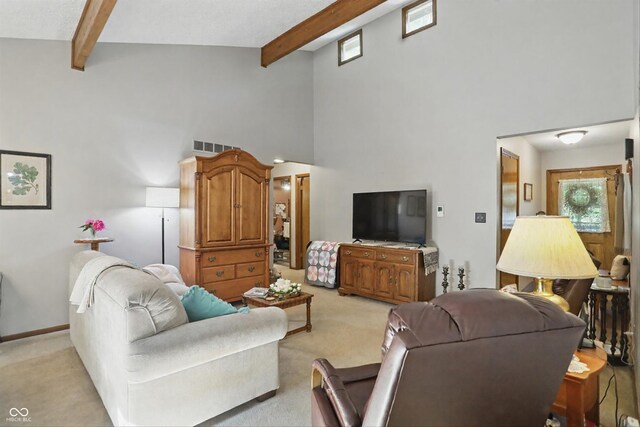 1712 S Flatrock River Rd, Rushville, IN 46173 - living area with light colored carpet, beamed ceiling, and high vaulted ceiling