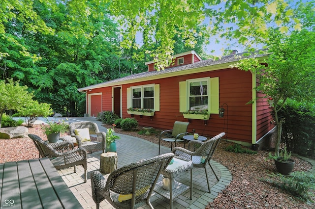 1712 S Flatrock River Rd, Rushville, IN 46173 - view of patio with a garage and driveway