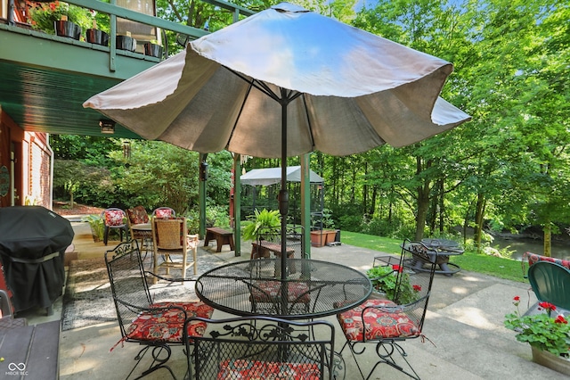 1712 S Flatrock River Rd, Rushville, IN 46173 - view of patio with outdoor dining space and grilling area