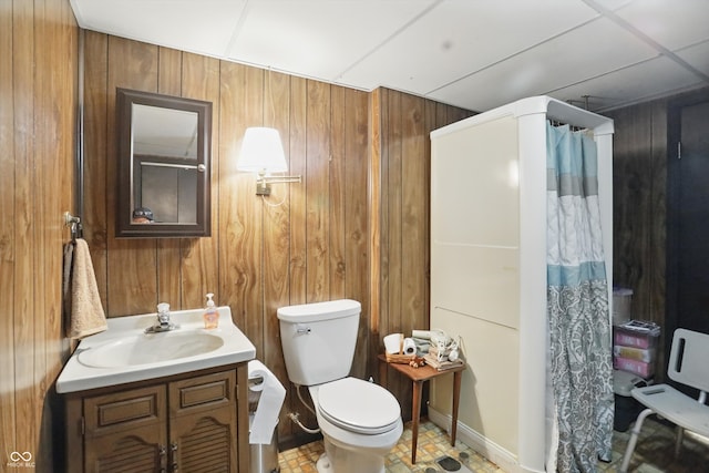 1712 S Flatrock River Rd, Rushville, IN 46173 - bathroom with wood walls, vanity, toilet, and a shower with shower curtain