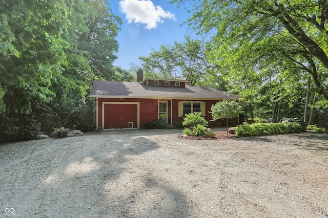 1712 S Flatrock River Rd, Rushville, IN 46173 - view of front of property featuring a garage, driveway, and a chimney