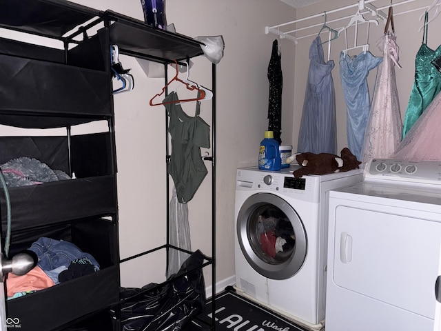 laundry area with separate washer and dryer