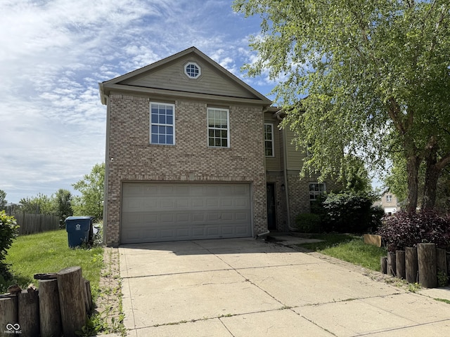 traditional-style home featuring brick siding, a garage, and driveway