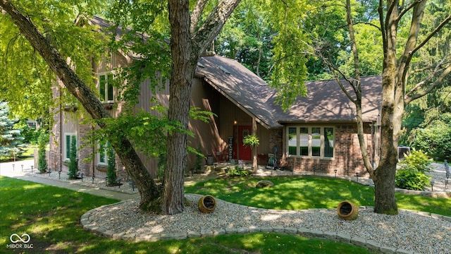 3479 Sugar Loaf Ct, Carmel, IN 46033 - view of front of house featuring brick siding, a front yard, and a shingled roof