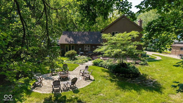 3479 Sugar Loaf Ct, Carmel, IN 46033 - view of grassy yard with a fire pit and a patio